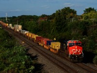 A rebuilt GE leads CN 106 through Beaconsfield.