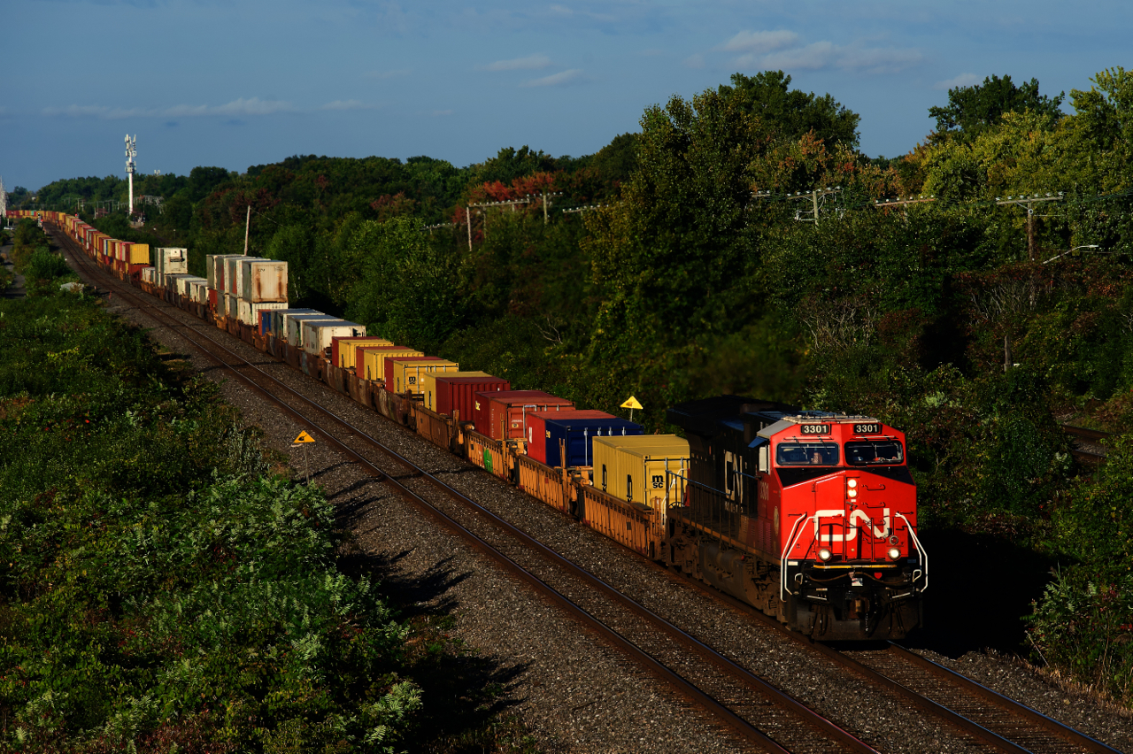 A rebuilt GE leads CN 106 through Beaconsfield.