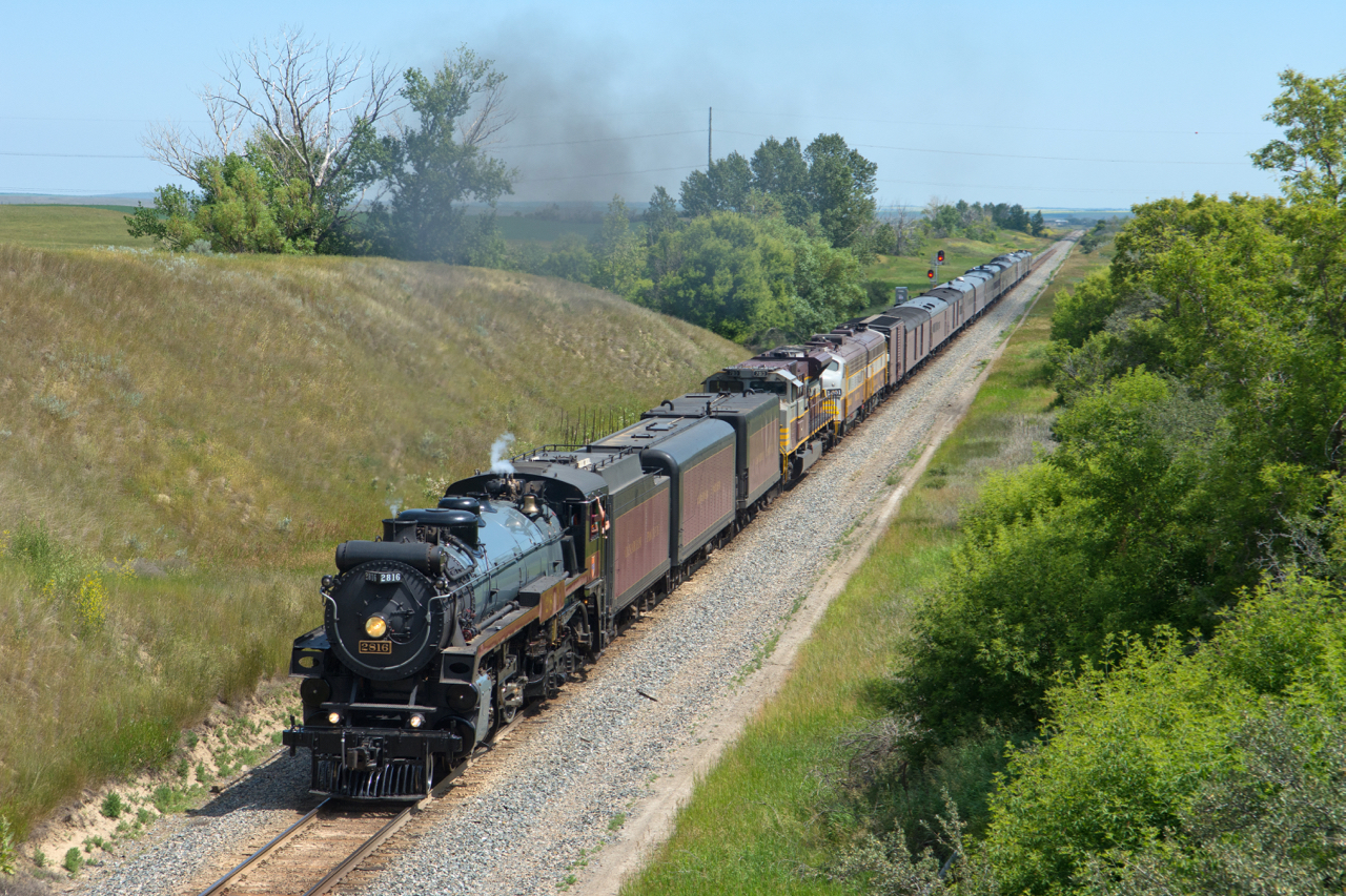 On the second last day of it's Calgary-Mexico City round trip, 2816 is seen about to duck under a wooden bridge just west of Waldeck on the Swift Current Sub.