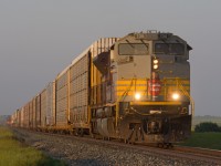 On my way home to Regina after a successful chase of 2816 from Moose Jaw to Dunmore, I stumbled upon this westbound leaving Swift Current. Needless to say that a little more chasing was in order. At 20:25 CP 7016 is seen on the approach to Antelope in some golden evening light.  With just over 300km still to cover to get home, needless to say the next morning at work came all to soon. I regret nothing! 