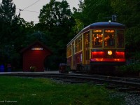 With the sun below the horizon, two strikes of the gong sound off as TTC Peter Witt streetcar 2894 pulls away from the east turning loop at the Halton County Radial Railway, including the original Toronto Suburban Railway Meadowvale station shelter.  This evening was an event for their membership (and invited photographers) in celebration of the museum's 70th anniversary, having been founded in January 1954.<br><br>The public event will take place next Saturday, September 21, 2024 at 1:30pm, featuring a number of invited guests (including founding member, Bob Sandusky,) a parade of streetcars, and unveiling of a plaque at the site of the first spike (just behind me in this image.)