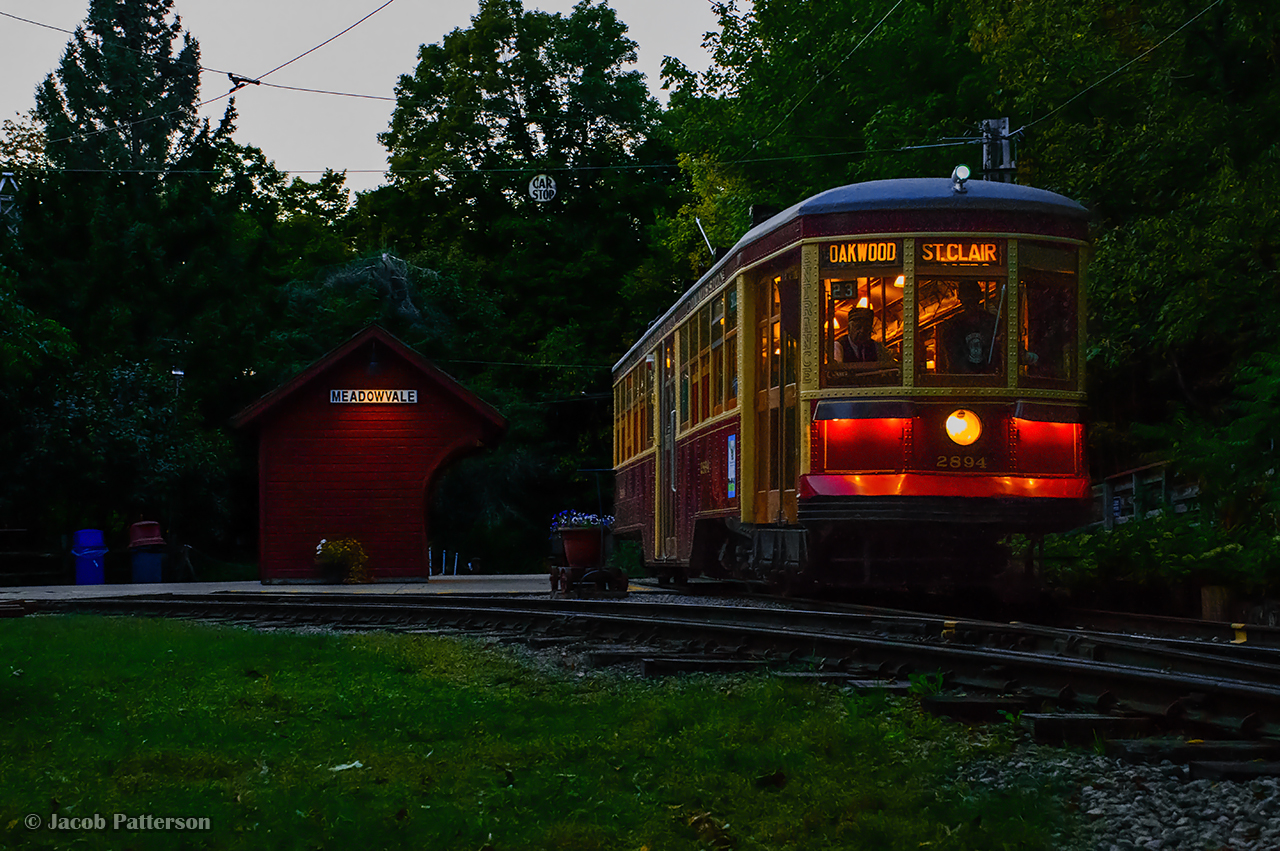 With the sun below the horizon, two strikes of the gong sound off as TTC Peter Witt streetcar 2894 pulls away from the east turning loop at the Halton County Radial Railway, including the original Toronto Suburban Railway Meadowvale station shelter.  This evening was an event for their membership (and invited photographers) in celebration of the museum's 70th anniversary, having been founded in January 1954.The public event will take place next Saturday, September 21, 2024 at 1:30pm, featuring a number of invited guests (including founding member, Bob Sandusky,) a parade of streetcars, and unveiling of a plaque at the site of the first spike (just behind me in this image.)