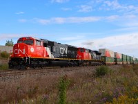 Former CN 5684 recently rebuilt as SD75IACC and renumbered CN 8301 is making easy work of the grade toward Tansley with Q122's train.

