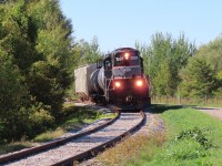 Returning from Innisfil, 1001 leans into the superelevated curve approaching Huronia Road. The City has recently installed a service road adjacent to the tracks which has opened up this area.