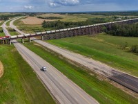 The BC Rail heritage unit, CN 3115 brings 101 sand loads across the 2584 foot long trestle at Rochfort Bridge. 