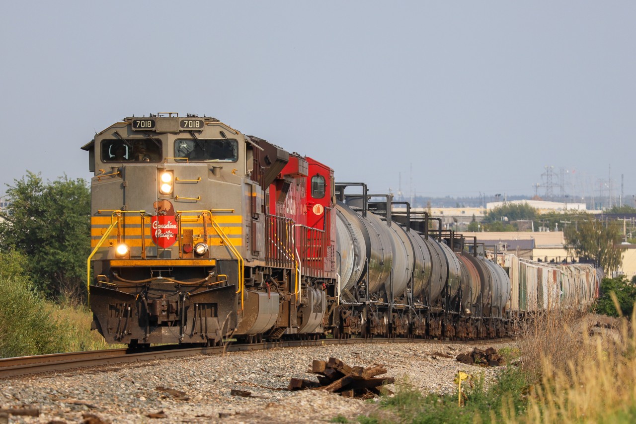 CPKC 419-08 navigates a small hill in Strathcona, after lifting at Lambton Park with heritage unit CP 7018 leading.