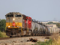 CPKC 419-08 navigates a small hill in Strathcona, after lifting at Lambton Park with heritage unit CP 7018 leading. 