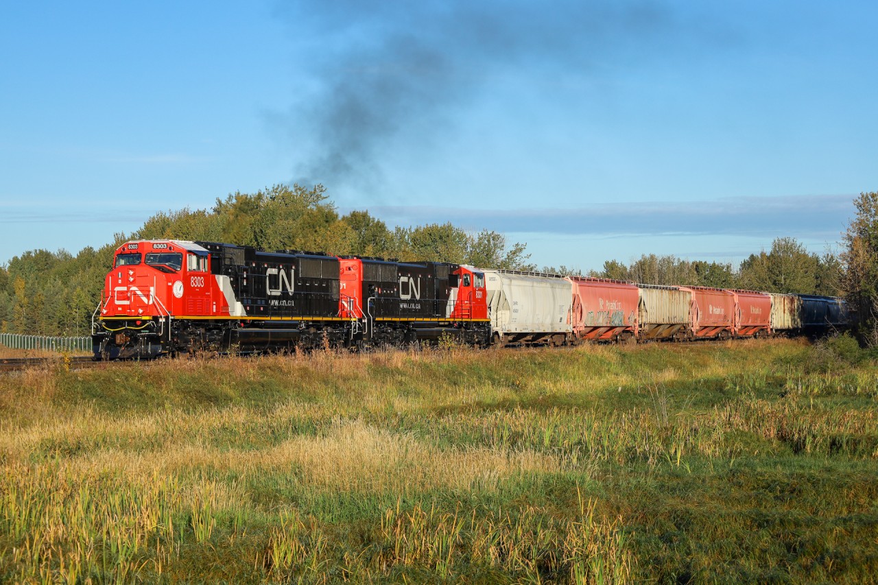 A pair of SD75IACC locomotives roll into the morning sun with M 31341 14.  CN 8303 and CN 8301 have both made their first trip into western Canada on the daily Winnipeg to Scotford manifest.