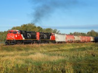 A pair of SD75IACC locomotives roll into the morning sun with M 31341 14.  CN 8303 and CN 8301 have both made their first trip into western Canada on the daily Winnipeg to Scotford manifest.  