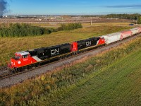 SD75IACC CN 8303 and CN 8301 roll through Harris East on the final approach to Scotford. 