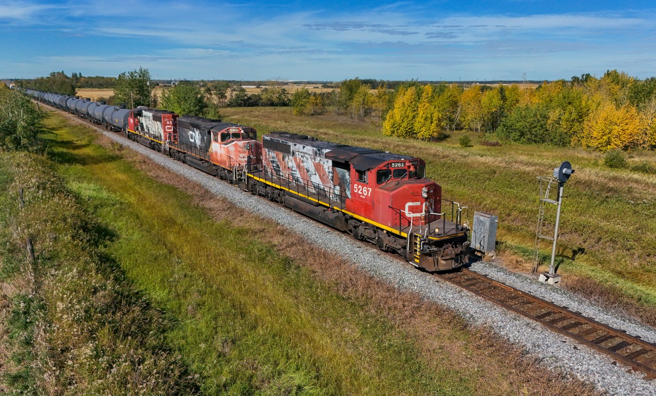 L 51151 16 passes the approach signal to the Gaudin Interlocking with CN 5267, CN 5316, CN 5293 and 71 cars.  While this part of the Vegreville Sub is OCS, there are two interlocking with searchlight signals; the Gaudin Interlocking and the Bruderheim Interlocking, which both cross CPKC lines.