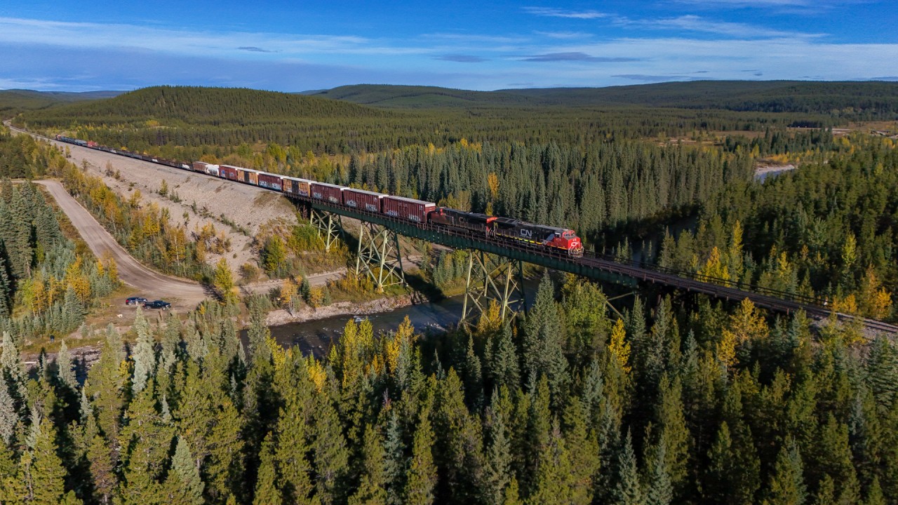 A 45951 16 crosses the Berland River with a short train, near Hanlon on the Grande Cache Sub. 

A 45951 16: CN 3110, CN 2907, CN 8302 – DP 2x0x1 – 30 cars