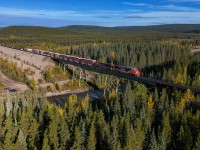 A 45951 16 crosses the Berland River with a short train, near Hanlon on the Grande Cache Sub. 

A 45951 16: CN 3110, CN 2907, CN 8302 – DP 2x0x1 – 30 cars