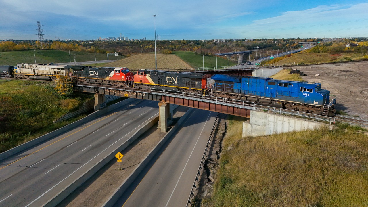 M 31651 27 rolls across the Yellowhead Highway with a colourful consist at one of my favourite locations in the city.