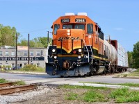 Props certainly help to make the scene sometimes. I’ve always loved all the old factories in Hespeler, even if the majority have been repurposed. My hopes today were simply to find BNSF 2968 and grab a few photos, especially as I’m not sure how long the BNSF Geeps will be sticking around. After no luck finding it in Guelph I decided to check the Fergus spur. As luck would have it they were finishing up at the chemical facility south of Guelph and had lumber loads for Preston in tow. Great lighting made for a nice slow chase and some decent shots. Here solo BNSF GP39V 2968 passes Four Fathers Brewing company as they enter  Hespeler with three cars in tow. 