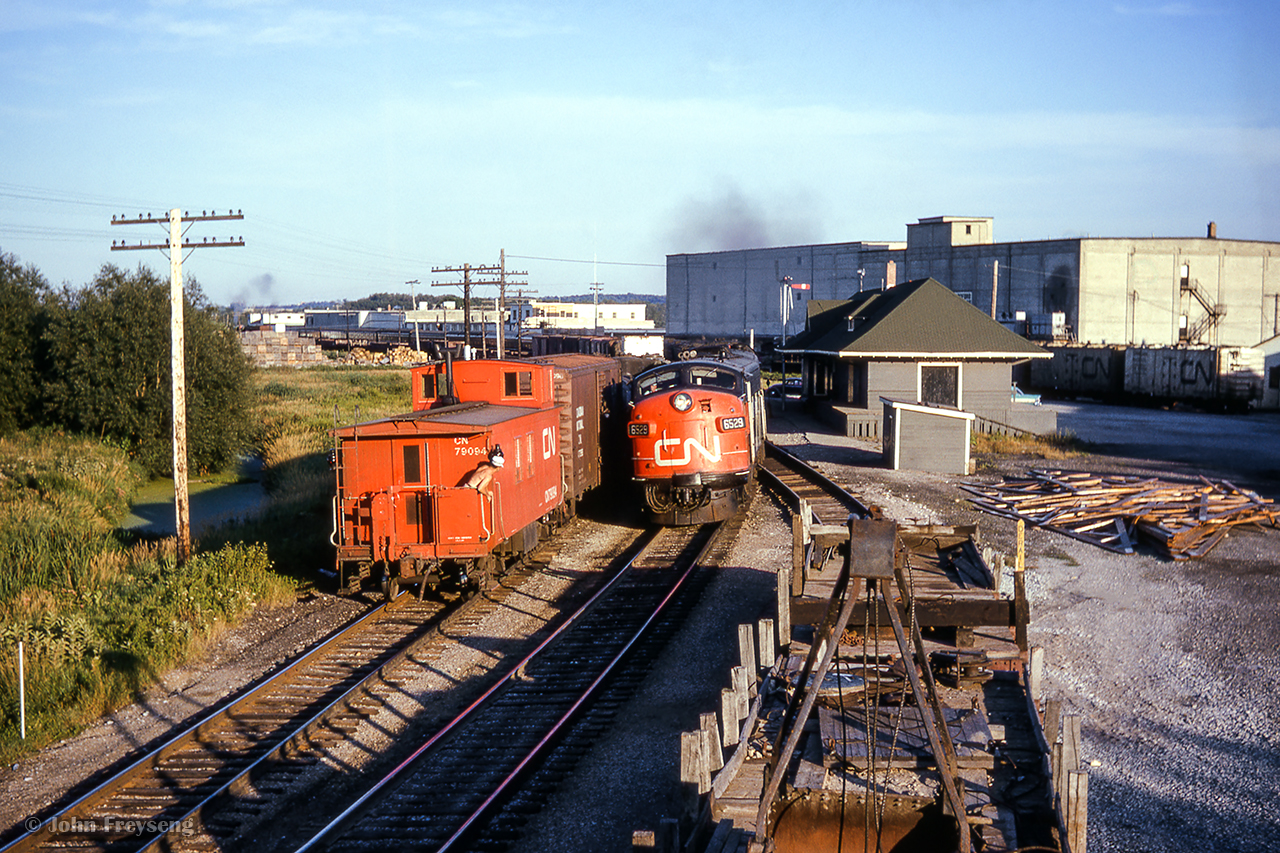 Heading into the evening sun, train 51, the "Super Continental" meets a southbound freight at Bradford.Scan and editing by Jacob Patterson.