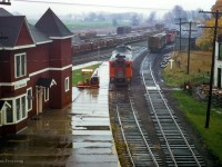 <b>Last CN Passenger service at Palmerston.</b> Operating as extra 6101, former train number 672 - the southbound RDC-1 passenger car from Owen Sound - is seen positioned on the Newton Sub side of the station on Saturday, October 24, 1970 for the final time. Arriving at 0655h, the Railiner will await the arrival of Extra 6354, formerly train 668 (RDC-2) from Southampton. Both will be combined and having met extra 6118 (RDC-1), the former train 662 from Kincardine, will depart at 0715h for the trip to Toronto (formerly train 658) via the Fergus, Guelph, Halton, and Weston Subs. Extra 6118, which had arrived at 0700h from Kincardine, will too depart at 0715h for Stratford.

<br><br>I believe the official last runs of the RDC service to Owen Sound, Kincardine, Southampton, and Goderich was the evening of Fri Oct 23, 1970. Although the Sat runs to Toronto (and Stratford) carried passengers, they were no longer operating as scheduled trains, hence the extra flags. Daylight Saving time ended early Sunday morning, Oct 25, 1979, and CN and CP would bring out their winter timetables at this time change.

<br><br><i>Scan and editing by Jacob Patterson.</i>

<br><br>More shots from this date:
<br><a href=https://www.railpictures.ca/?attachment_id=45100>Extra 6101 arriving at Palmerston</a>
<br><a href=https://www.railpictures.ca/?attachment_id=48776>Extra 6354 arriving at Palmerston</a>
<br><a href=https://www.railpictures.ca/?attachment_id=50370>All three RDCs lined up at the station</a>