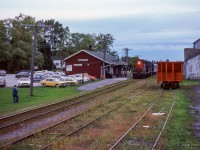 Shot during the 1978 TTC strike, VIA train 632 from Union to Stouffville slows for a stop at Markham's 1871-built station.  Originally a Toronto & Nipissing Railway structure, it has served passenger operations for the Midland Railway, GTR, CNR, VIA Rail, and presently GO Transit.

<br><br>See <a href=https://www.railpictures.ca/?attachment_id=55096>Isaac Bryson's recent night shot here,</a> 46 years later.  The station and main track remain, with everything else removed.

<br><br><i>Scan and editing by Jacob Patterson.</i>