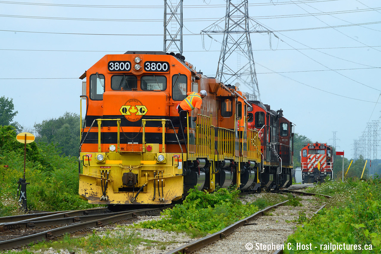 A photo of the transition from OSR to GEXR: The day before the last OSR trains would run on the Guelph Junction Railway, three GEXR locomotives were hurried over to Guelph by L540. Pictured is L540 with a pair of CN GP9's about to set the locomotives off on the north leg of the wye while OSR waits north of Woodlawn Road with OSR (nee CP) 1591. CN 542 with GMD-1 1408 solo was behind me waiting at the switch to CN, making for a brief flurry of activity during Lunch. OSR would take these three south to Guelph Junction as there were no plans to make a southbound run on the 29'th - all OSR power would head north and stay in Guelph as they ran three trains (with four crews).Train one and two | Recrew of Train two | Train Three - the last one to operate and would park at 6:23 PM the next day. A note about this spot today you'll find a small yard here, the track has been vastly expanded.