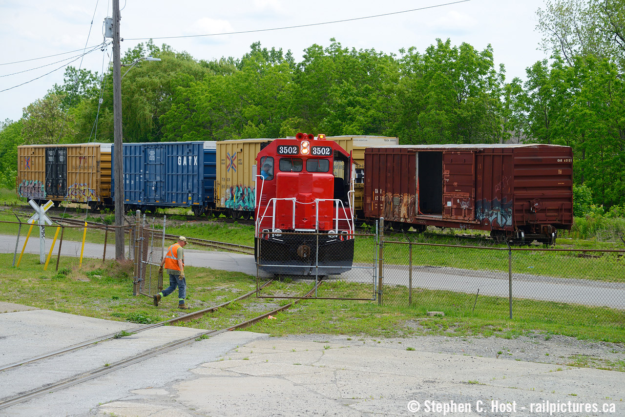 JLCX 3502, a GP35 formerly of the Denver and Rio Grande, has its gyrolight rotating while the crew close the gate on WP Warehousing's property. The GIO crew will return to the N&ST Spur and head back toward the Grimsby sub to cross over onto the Thorold spur. Formerly known as the Grantham Subdivision in the CN days, in the GIO days this line was officially called, on their timetable and paperwork the N&ST Spur. This locomotive was returned to JLCX and is no longer being used by GIO. What a treat this was to hear this thing working though, I enjoy any EMD with a turbo.