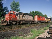 During an early June morning, an eastbound CP train is viewed waiting for a fresh crew at Quebec Street Yard in London, Ontario. The consist included; SOO Line SD40-2 6610, SD40-2 5844 and CSXT GP40 6562. The former Chessie unit was heading to AMF in Montreal, Quebec where it eventually would become HATX 401. And ironically by the fall of 1994 was immediately leased to CP. At the time, the railway had a large group of Helm Financial Corporation units leased as part of their rapidly expanding mid-90’s lease fleet.