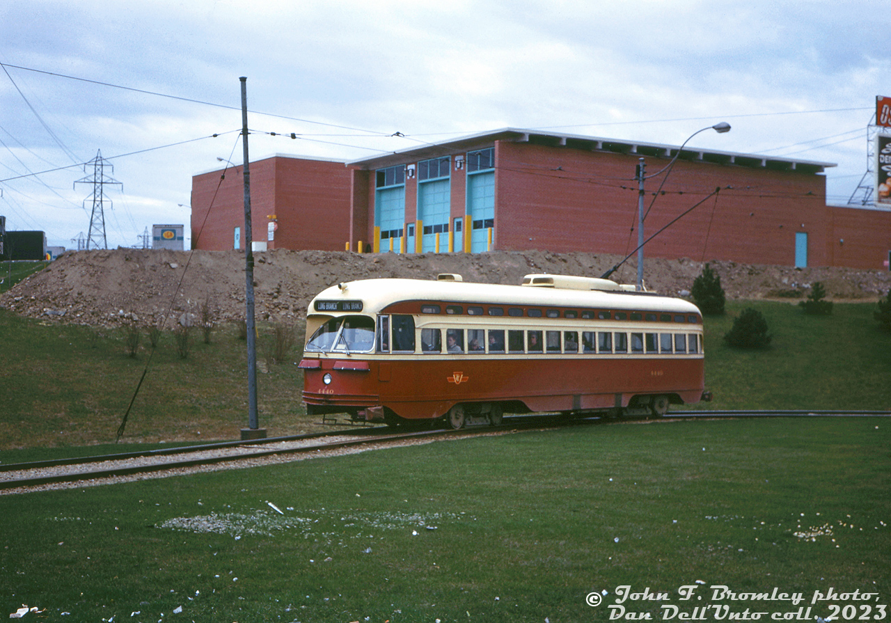 TTC PCC 4440 (A7-class, CC&F 1949) operates on the Long Branch streetcar route, laying over at Humber Loop before its trip west through Mimico to Long Branch Loop. The Long Branch streetcar, later the 507, connected here with the Queen streetcar and other services. In the background is the old Oshawa Group warehouse (IGA, Food City, Towers brands), just east of the Ontario Food Terminal.

John F. Bromley photo, Dan Dell'Unto collection slide.