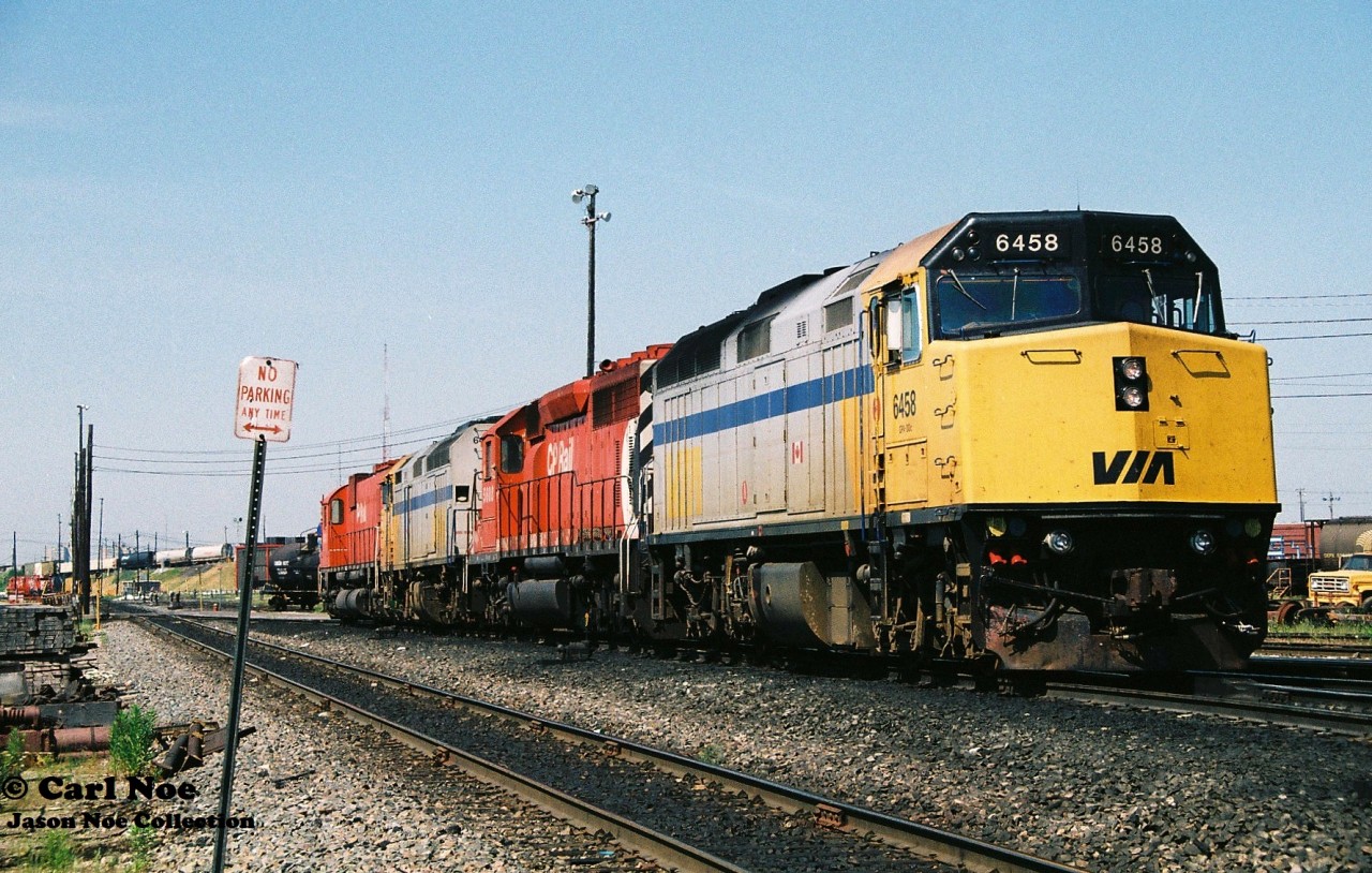 Pictured rolling off the CP Toronto Yard shop tracks is a consist that could have only been created during the mid-90’s. The consist was heading towards their train that was assembled on the departure tracks at the east-end of the yard. The unique lash-up included; VIA Rail 6458, CP 5608, VIA Rail 6452 and CP 4742. At the time power short CP was leasing anything they could. Also, the big 6 had just been un-retired during the previous winter when the railway had re-activated the remaining operable big MLW-built fleet due to the growing motive-power shortage. As well at the time, the company had a large group of Helm Financial Corporation units leased as part of their rapidly growing mid-90’s lease fleet.