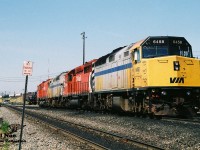 Pictured rolling off the CP Toronto Yard shop tracks is a consist that could have only been created during the mid-90’s. The consist was heading towards their train that was assembled on the departure tracks at the east-end of the yard. The unique lash-up included; VIA Rail 6458, CP 5608, VIA Rail 6452 and CP 4742. At the time power short CP was leasing anything they could. Also, the big 6 had just been un-retired during the previous winter when the railway had re-activated the remaining operable big MLW-built fleet due to the growing motive-power shortage. As well at the time, the company had a large group of Helm Financial Corporation units leased as part of their rapidly growing mid-90’s lease fleet.