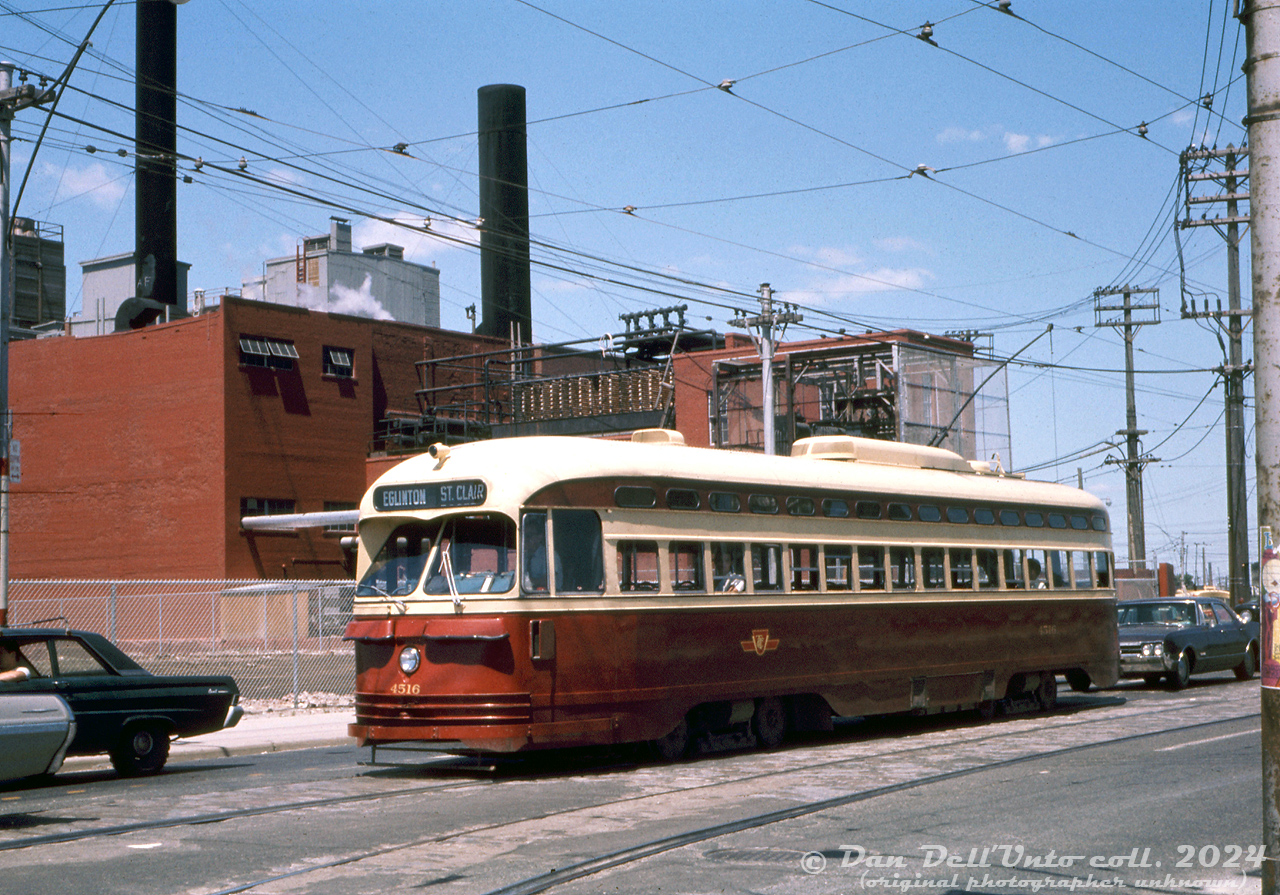 TTC PCC 4516 (A8-class, built by CC&F 1951) waits southbound on Weston Road waiting to make the left turn and head east on St. Clair Avenue. IT has just departed nearby Keele Loop, operating on a St. Clair run eastbound and then northbound on Mount Pleasant for Eglinton Loop. In the background is part of Swift's (later Bunge, demolished around 2009), one of the handful of packing houses that once populated this area of West Toronto.

Original photographer unknown, Dan Dell'Unto collection slide.