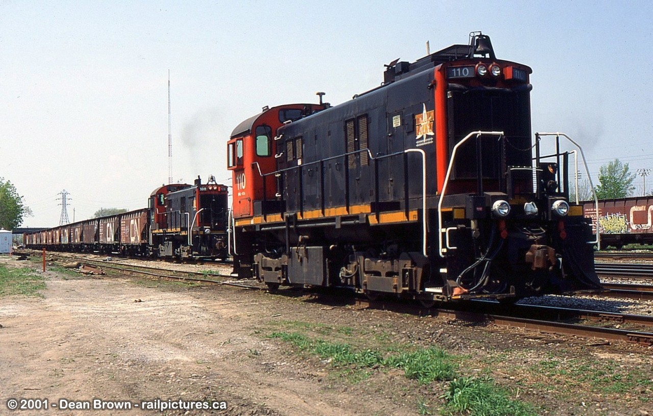 Back when CN had a 72-hour work block per track to lower the tracks under Merritt St Bridge, Trillium was helping out with the Ballast cars. There were detours for Trillium to head onto the Grimsby Sub to Clifton onto the CN Stamford Sub to Port Robinson onto Robbins West and the CP Hamilton Sub to Feeder and back on their trackage.

TRRY 110 and 108 worked at Merritton in May of 2001.