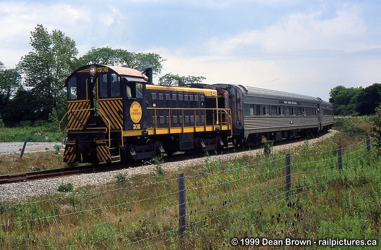 Trillium Railway ran an excursion trip between Port Colborne and Forks Jct during Canal Days in Aug of 1999. The power was PCHR S2 308, PCHR C425 6101, and the five NYC coaches from Medina, NY. PCHR 308 heads northbound at Elm St. in Port Colborne.