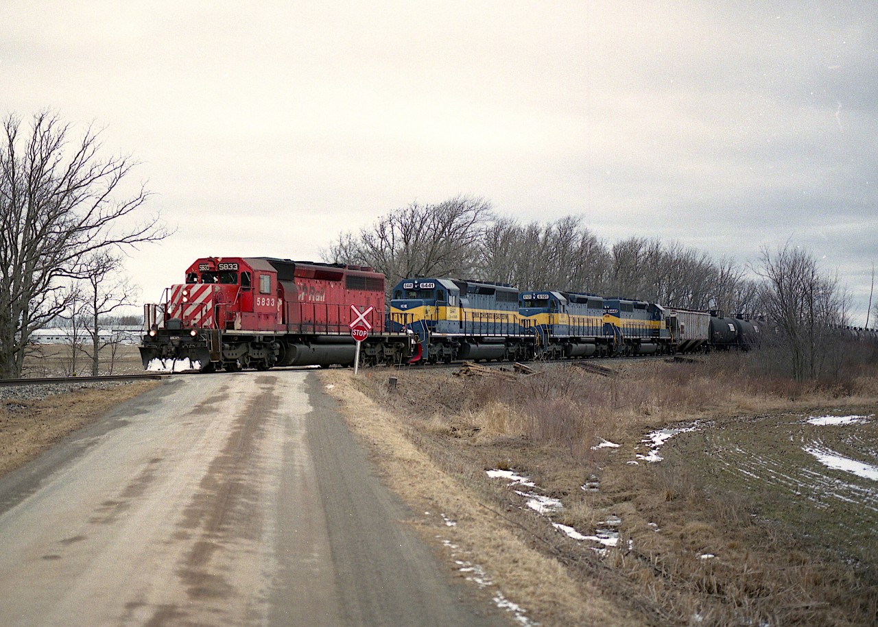 For a period a while back, give or take 10 years, I enjoyed sitting by the CP at Concession 7 up on the hill from Grimsby. It was a heady few years when all those ethanol loads were coming thru featuring a variety of SD40-2 paints.  It is a real shame these trains are far and between now, and are no longer running the Ham sub.
Here is a typical ethanol load train from the time...CP 5833, ICE 6441, 6101 and 6442 with roughly 80 loads.
The first and third units seen on this train were retired in 2017 and the other two were dealt off to the fledgling  RCP&E in 2014.
This is still my favourite 'go-to' location if I ever hear of anything notable to photograph, despite the fact it is getting rather overgrown.