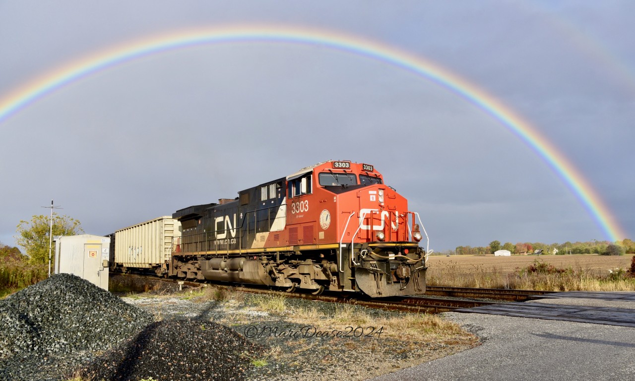 Last week Southern Ontario was a mix of sunshine, cloud and rain showers which made for some nice backgrounds including this rainbow over CN Train 509 heading east out of Sarnia at Telfer Sideroad, October 16, 2024.