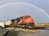 Last week Southern Ontario was a mix of sunshine, cloud and rain showers which made for some nice backgrounds including this rainbow over CN Train 509 heading east out of Sarnia at Telfer Sideroad, October 16, 2024. 