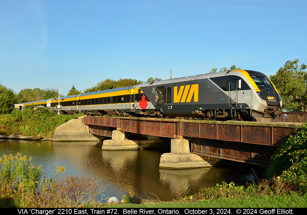 The look of the future is NOW....  VIA "Charger" #2210 leads train #72 through Belle River, Ontario on October 3, 2024.  With the arrival of the Charger sets the days of F40PH-2Ds and P42DC locos, with classic VIA consists are numbered.  Get your shots or lose out forever...  Remember those FP7's and FPA4's?  Same thing all over again.....