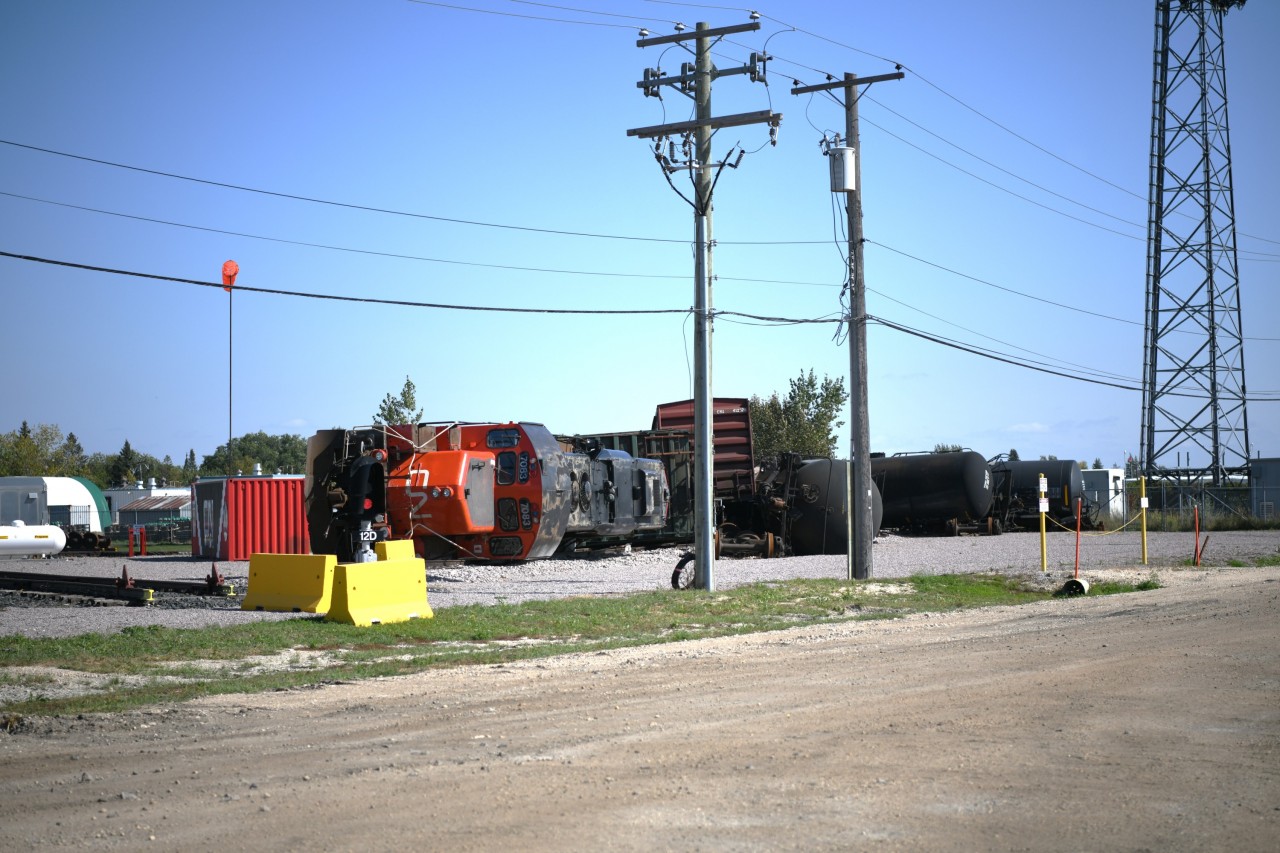 Derailment Training  
The derailment training site at the CN Campus in Transcona provides a realistic, hands-on experience for new and existing employees. 
CN 7083 and a variety of other rolling stock lay strewn across the ground just off Red Jones Road behind the training center building.