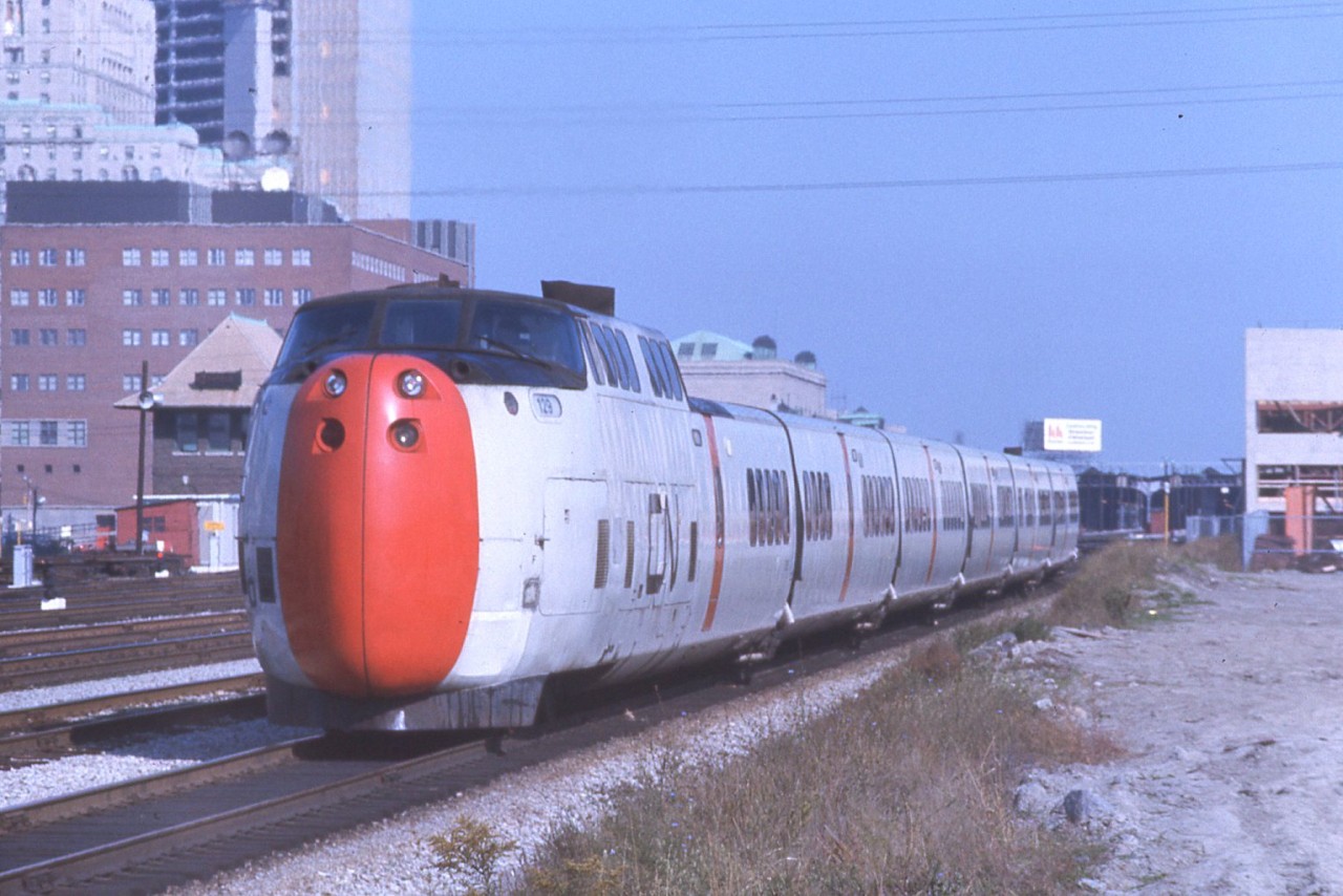 I was recently given a slide collection from a good friends late brother, Maurice Dann. Gong through them I found this great shot of the CNR Turbo heading into Union station for its Montreal run. Its not too often you would see the Turbo this clean and John street surrounded by nothing.