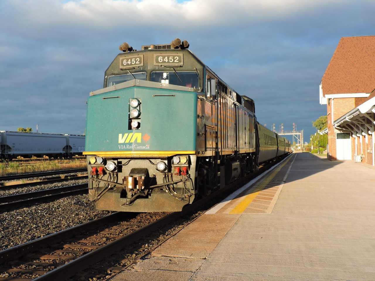 The clouds break just enough to put some light on VIA 6452 with train 84 at Sarnia preparing to depart for points east, how much longer will these F40's be in corridor service with the new charger trainsets around?