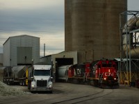 Normally served by CN 596 in the evening these days, O-I Canada is rarely being visited by CN 500 during the day. Here IC 9632 & CN 4760 lift two cars from the plant.