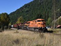 This train worked at a location mile 137.9 referred to as Tochty for over an hour; so the plan was to find a spot worthy of catching it running eastward. Tochty was too tight, from the highway it was a shot against the sun and the other side of the work area was the Moyie River. And no road in.
So, we headed about 5 miles eastward, little over halfway to Moyie (mile 128) to Bateman Rd, a little gravel access to a couple of homes as well as a rail crossing.  And waited. It was a glorious day, clear skies, nice temperatures, and the reward was CP 8781, KCS 4070 and 4155 rolling thru in a rather nice setting. Not easy to shoot in these parts, so much of it is heavily wooded. And this is not a very well used line. Pity the Hapag-Lloyd paint could use a good wash, but there is no money in that. :o)