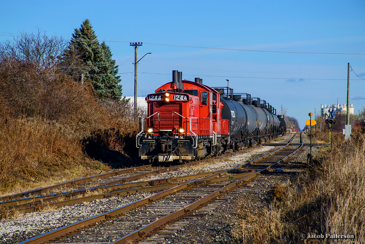 Autumn means propane season on the OSR, often requiring a couple extras running on a weekend to deliver cars to Factor Gas in St. Thomas.  A par of OSR's ex-CP pups are lifting inbound cars out of the Wabash Transfer before shoving back to Factor and delivering empties to CN.