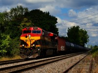 A KCS ET44AC leads ethanol train CPKC 528 past the abandoned LaSalle Yard.