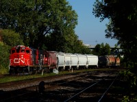 CN 500 has just left the Port of Montreal and is waiting for its light at Hibernia. Once VIA 60 passes on its way to the Victoria Bridge to wye its train, they will back into Pointe St-Charles Yard.