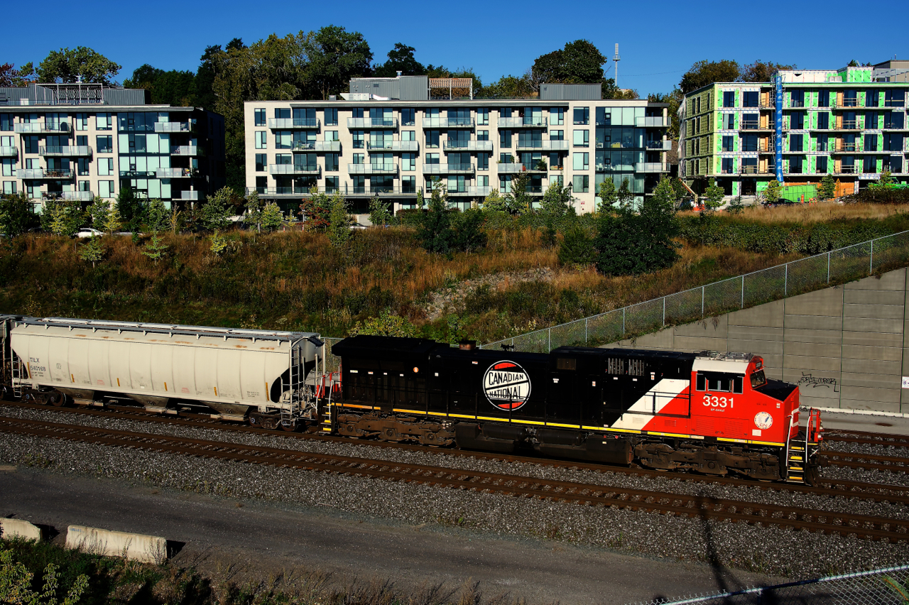 CN 3331 with a vintage CN logo on the long hood leads CN 322. This logo was briefly used by CN after its founding and was based on the Canadian Northern's logo.