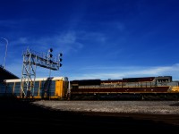 Heritage unit CP 7012 leads a 526-axle long CPKC 230 through Dorval.