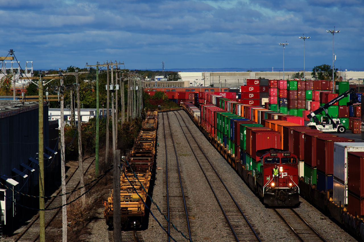 CPKC 2-112 is arriving in Lachine IMS Yard, with the conductor getting ready to throw a switch.