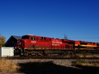 CPKC 231 is about to cross the CPKC/VIA Rail diamond at De Beaujeu.