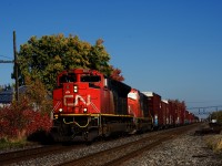 CN 369 has a pair of EMDs for power as it passes through Coteau.