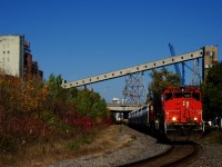 CN 500 is leaving the Port of Montreal with hoppers and baretables.