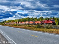 A quartet of scrap bound locomotives had me heading up to the "Raith Flats" to capture Winnipeg-Toronto freight 222-17. Seen rolling alongside Highway 17 between Savanne and Raith around Mile 64,  getting up to speed after a meet with a westbound hotshot at Savanne, CP 8792-6079-9021 led the train with CP SD40-2 5713- GP9u 1585- SD40-2 5700- 5721 dead in trail, presumably headed for scrap.